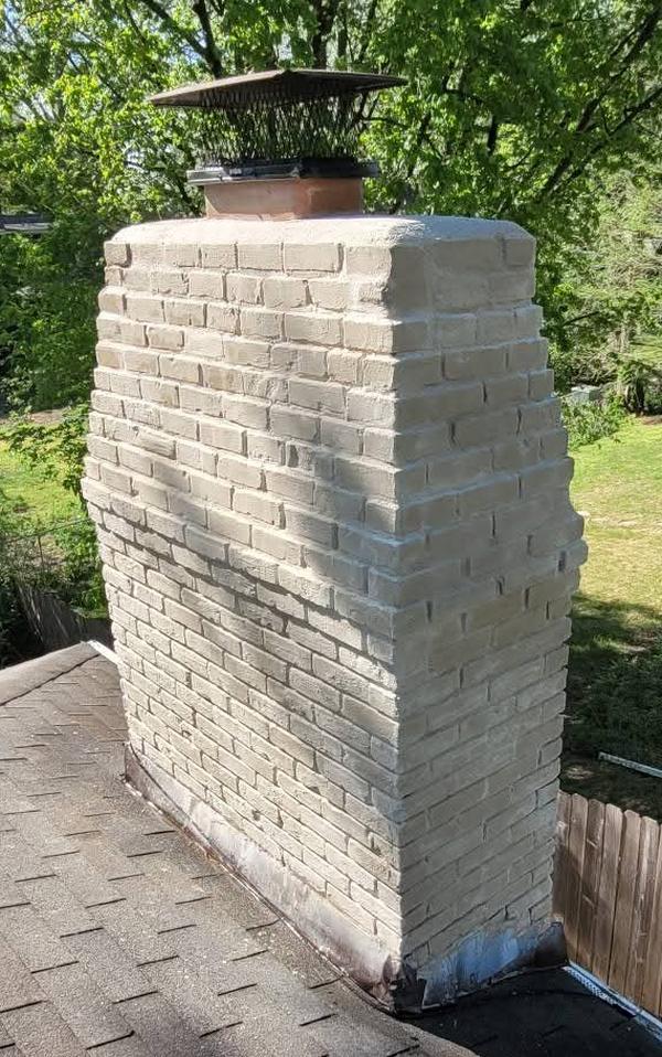 Brick chimney after repair, clean and intact